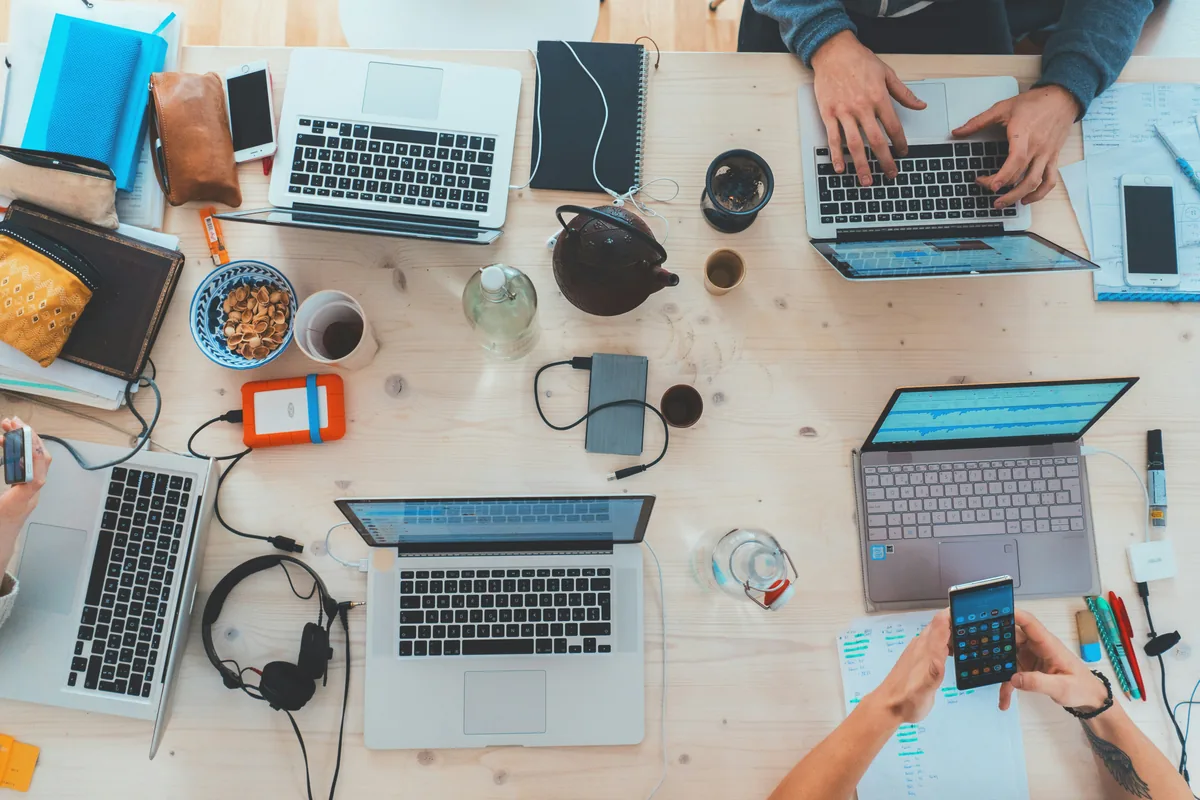 Software development professionals collaborating in a modern workspace